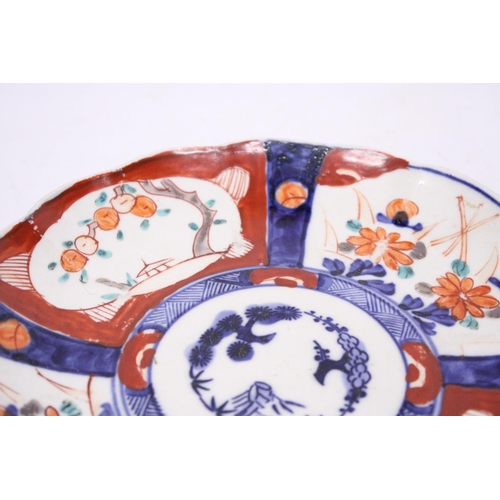 380 - TWO ANTIQUE JAPANESE IMARI HAND PAINTED LOBED EDGED PLATES - 21 AND 22 CM