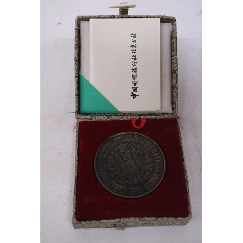 389 - A BOXED BRONZE MEDAL 