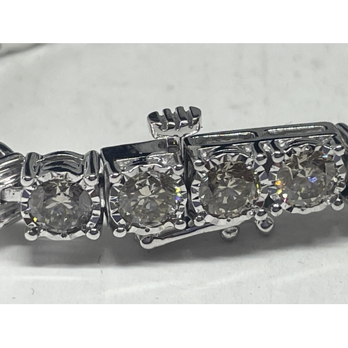 503 - A NEW 9 CARAT WHITE GOLD BRACELET, SET WITH BRILLIANT CUT DIAMONDS - TOTAL DIAMOND WEIGHT 11.10 CARA... 