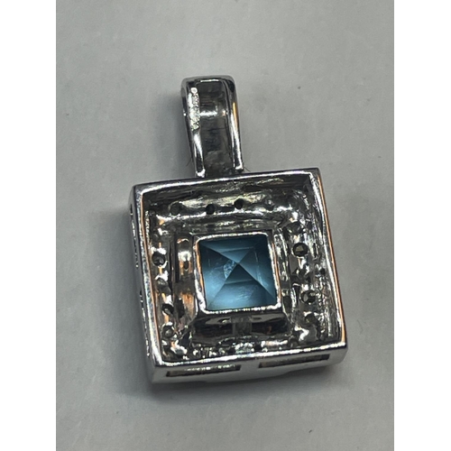 505 - A 9 CARAT WHITE GOLD SQUARE PENDANT WITH CENTRE BLUE TOPAZ SURROUNDED BY DIAMONDS IN A PRESENTATION ... 