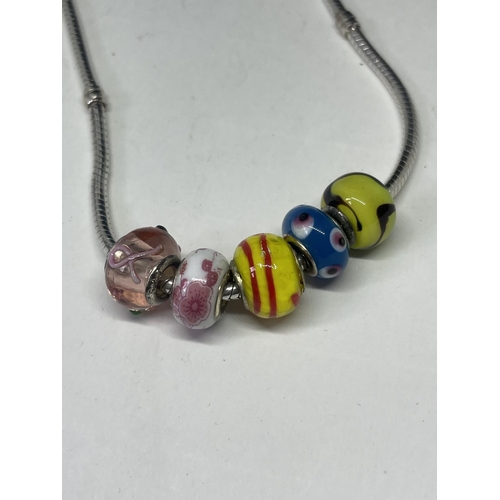 523 - A SILVER PANDORA NECKLACE WITH FIVE GLASS CHARMS