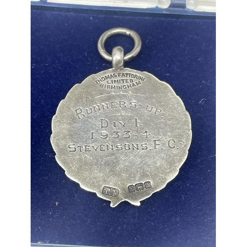 527 - A HALLMARKED BIRMINGHAM SILVER FOOTBALL MEDAL IN A PRESENTATION BOX