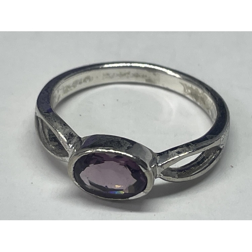 532 - A SILVER AND AMETHYST RING IN A PRESENTATION BOX