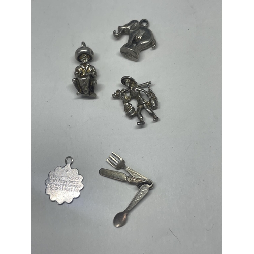 546 - SEVEN SILVER ITEMS TO INCLUDE TWO BELLY BARS AND FIVE CHARMS