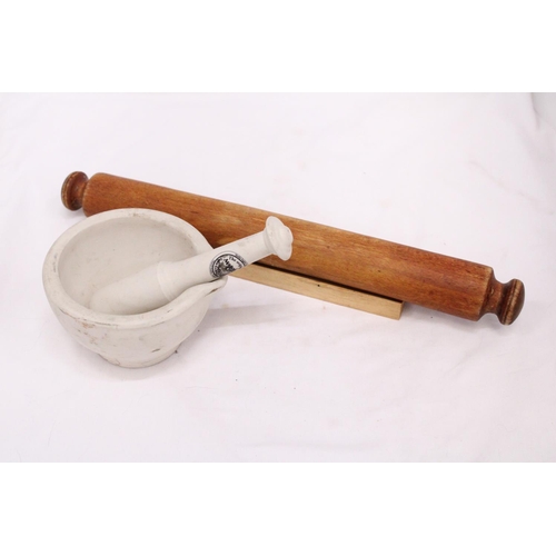 277 - A MASON CASH CERAMIC PESTLE AND MORTAR AND A 'GOURMET' ROLLING PIN AND STAND