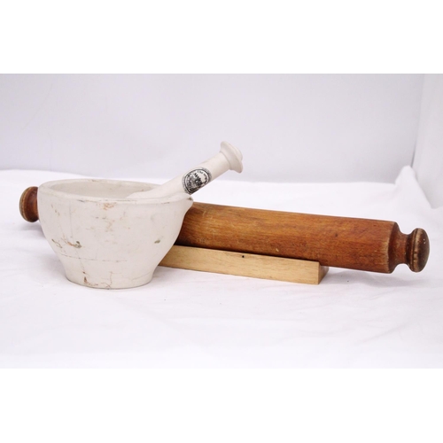 277 - A MASON CASH CERAMIC PESTLE AND MORTAR AND A 'GOURMET' ROLLING PIN AND STAND