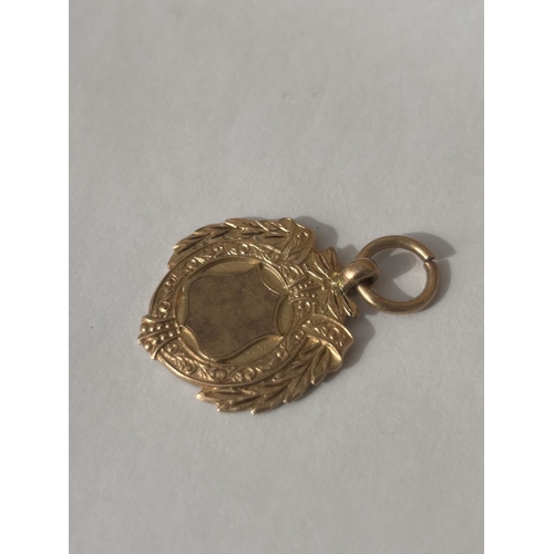 508 - A HALLMARKED 9CT GOLD BIRMINGHAM SPORTING FOB INSCRIBED 