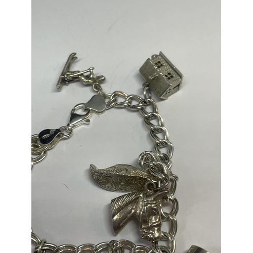 524 - A SILVER CHARM BRACELET