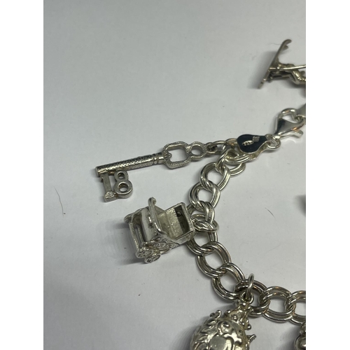 524 - A SILVER CHARM BRACELET