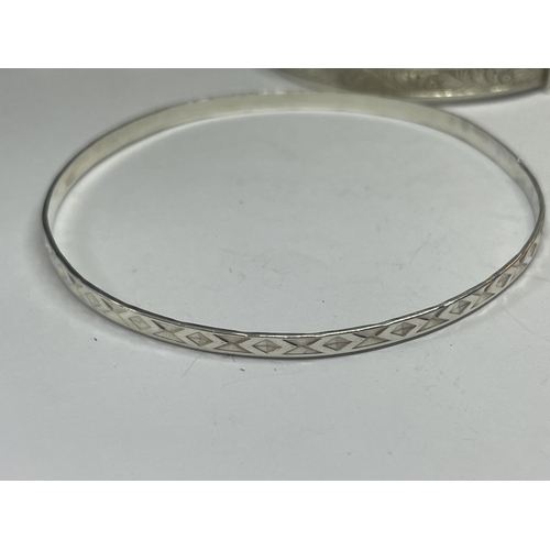 547 - THREE SILVER BANGLES