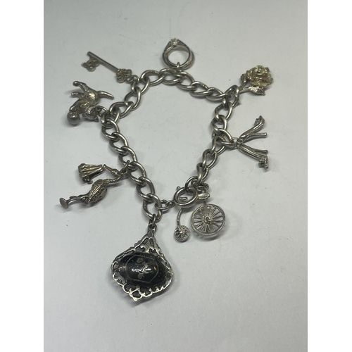 549 - A SILVER CHARM BRACELET