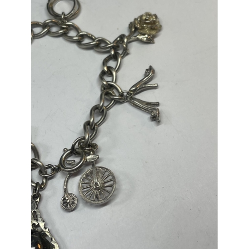 549 - A SILVER CHARM BRACELET