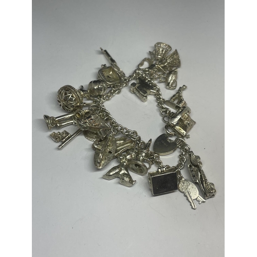 555 - A SILVER CHARM BRACELET