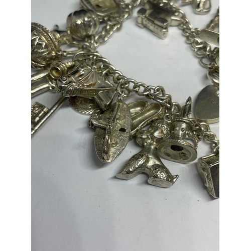 555 - A SILVER CHARM BRACELET