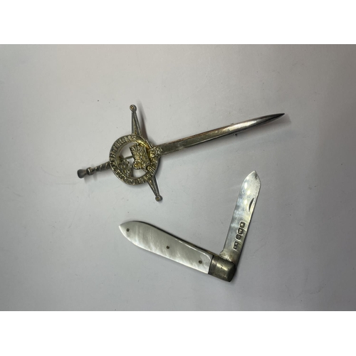 562 - A SILVER KILT PIN AND A SILVER FRUIT KNIFE