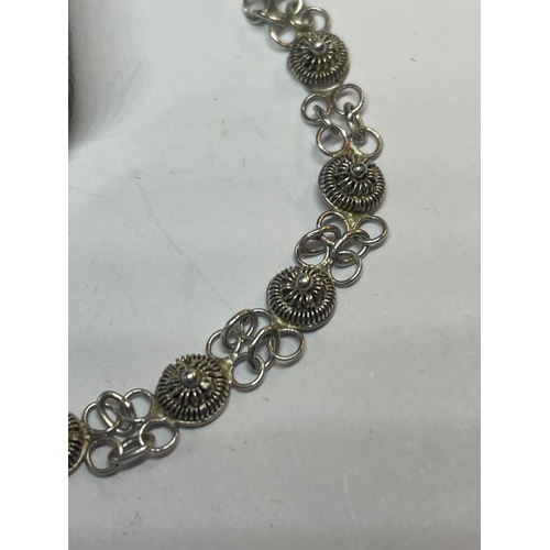 569 - A SILVER BROOCH AND BRACELET