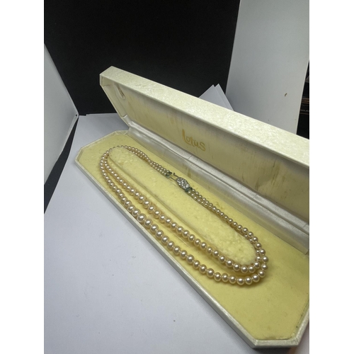 571 - A SET OF LOTUS DOUBLE STRAND PEARLS IN A PRESENTATION BOX