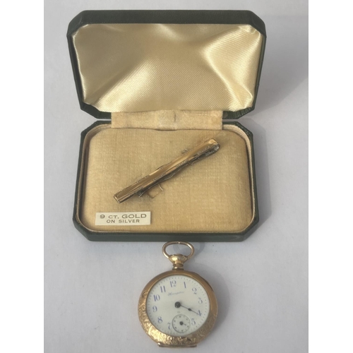 600 - TWO GOLD PLATED ITEMS TO INCLUDE A 9CT GOLD ON SILVER TIE PIN AND A 14CT GOLD PLATED FOB WATCH