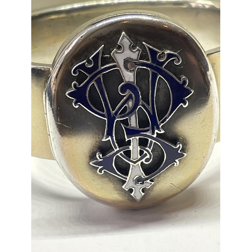 647 - A VICTORIAN COAT OF ARMS BANGLE