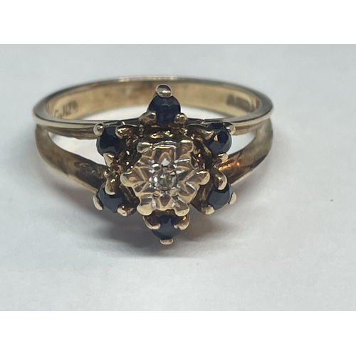 654 - A 9 CARAT GOLD RING WITH A CLUSTER OF DIAMONDS AND SAPPHIRES SIZE K/L