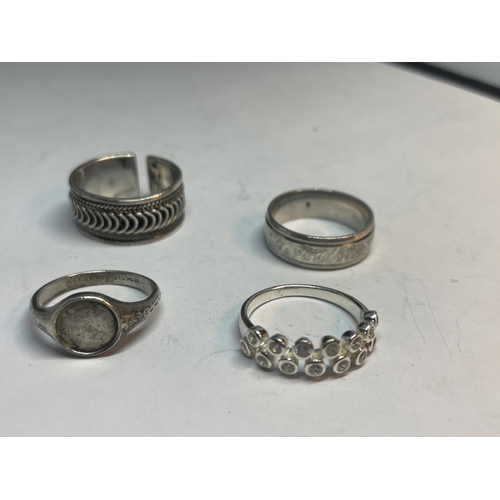 674 - FOUR VARIOUS SILVER RINGS