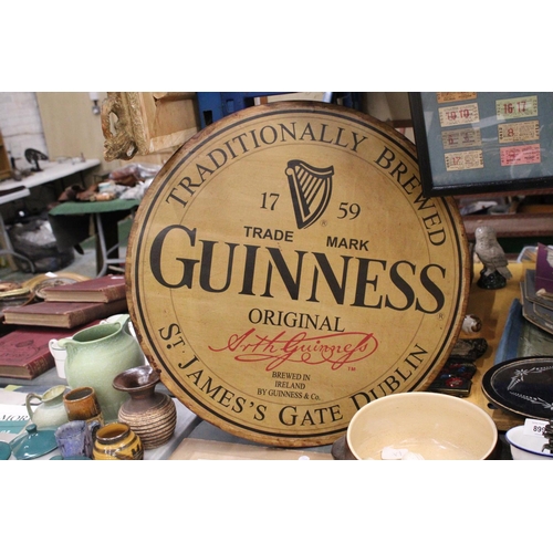 870 - A LARGE WOODEN CIRCULAR GUINESS ADVERTISING SIGN 24