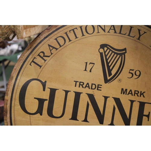 870 - A LARGE WOODEN CIRCULAR GUINESS ADVERTISING SIGN 24