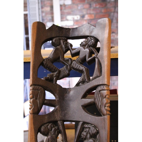 883 - A VERY HEAVY CARVED AFRICAN BIRTHING CHAIR -APPROXIMATELY 91M