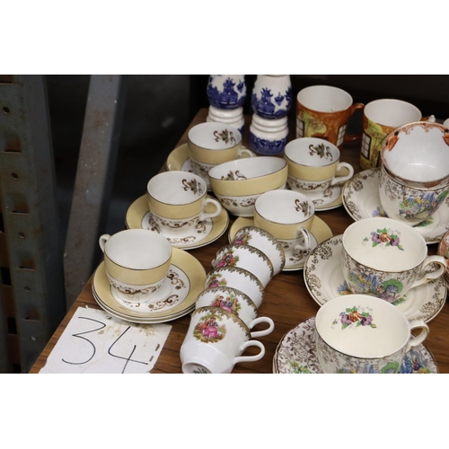 1185 - A MIXED LOT OF TEAWARE TO INCLUDE CUPS, SAUCERS, SIDE PLATES. CAKE PLATES, CREAM JUG SUGAR BOWL ETC