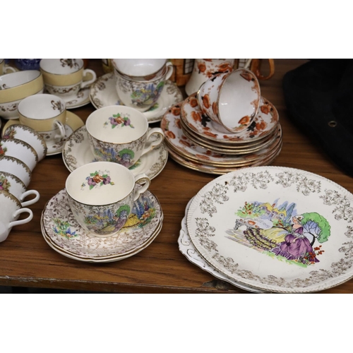 1185 - A MIXED LOT OF TEAWARE TO INCLUDE CUPS, SAUCERS, SIDE PLATES. CAKE PLATES, CREAM JUG SUGAR BOWL ETC