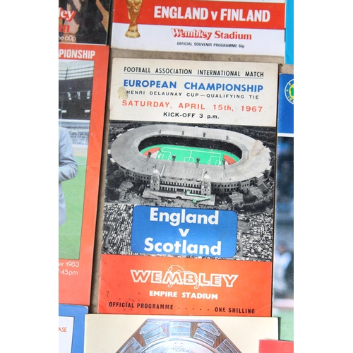 1746 - AN ASSORTMENT OF CLUB AND INTERNATIONAL FOOTBALL PROGRAMMES TO INCLUDE A 1984 MILK CUP FINAL GAME BE... 