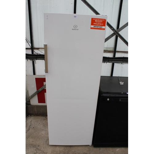 2301 - A WHITE INDESIT UPRIGHT FRIDGE BELIEVED IN WORKING ORDER BUT NO WARRANTY