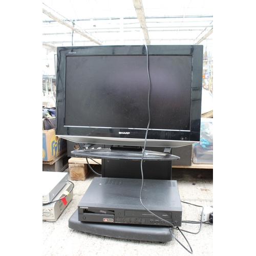 2403 - A SHARP TELEVISION WITH STAND AND SAMSUNG DVD PLAYER