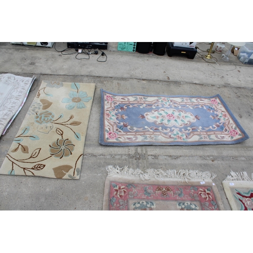 2497 - THREE VARIOUS SIZED PINK PATTERNED RUGS