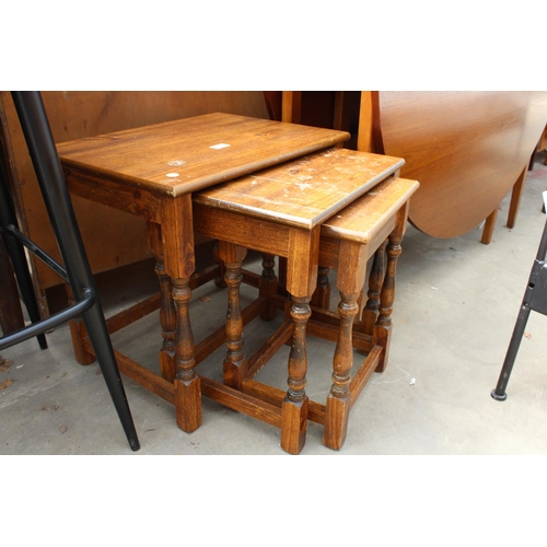 2612 - A NEST OF THREE HARDWOOD TABLES