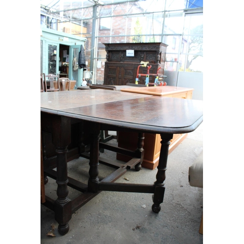 2658 - AN EARLY 20TH CENTURY OAK GATELEG DINING TABLE ON TURNED LEGS 72