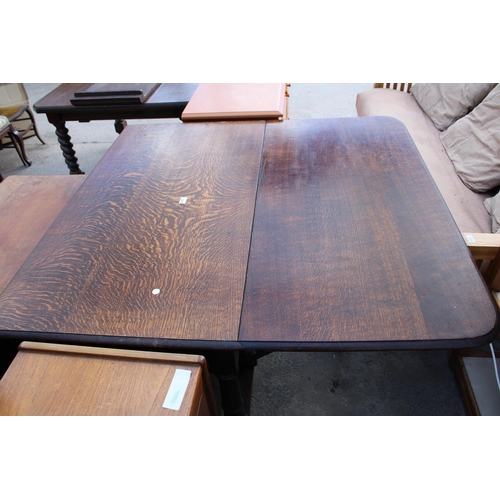 2658 - AN EARLY 20TH CENTURY OAK GATELEG DINING TABLE ON TURNED LEGS 72