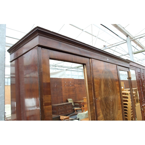 2718 - AN EDWARDIAN MAHOGANY DOUBLE MIRROR-DOOR WARDROBE ENCLOSING CUPBOARDS AND FOUR GRADUATED DRAWERS, 74... 