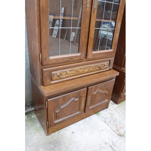 2803 - A MODERN OAK CABINET WITH GLAZED AND LEADED UPPER PORTION, 37