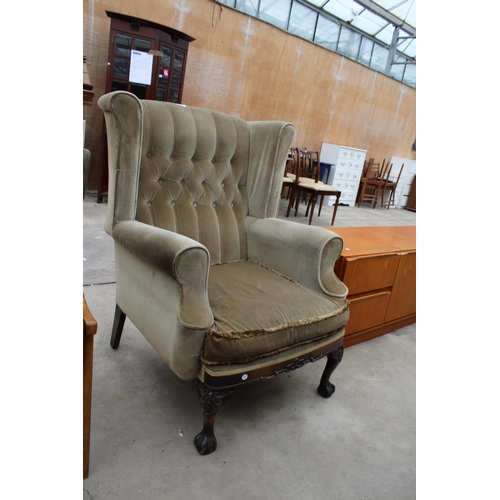 2859 - A GEORGIAN STYLE WINGED BUTTON-BACK EASY CHAIR ON FRONT CABRIOLE LEGS WITH CARVED KNEES ON BALL AND ... 