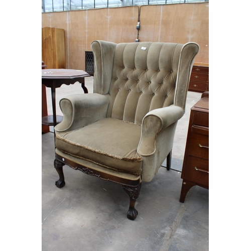 2859 - A GEORGIAN STYLE WINGED BUTTON-BACK EASY CHAIR ON FRONT CABRIOLE LEGS WITH CARVED KNEES ON BALL AND ... 