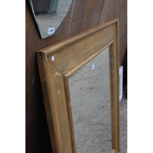 2882A - A MODERN OAK FRAMED WALL MIRROR, 51