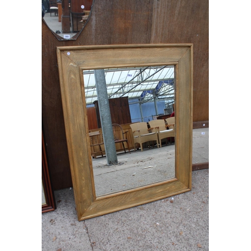 2882A - A MODERN OAK FRAMED WALL MIRROR, 51