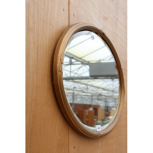 2898 - A MODERN OVAL BEVEL EDGE WALL MIRROR, 25