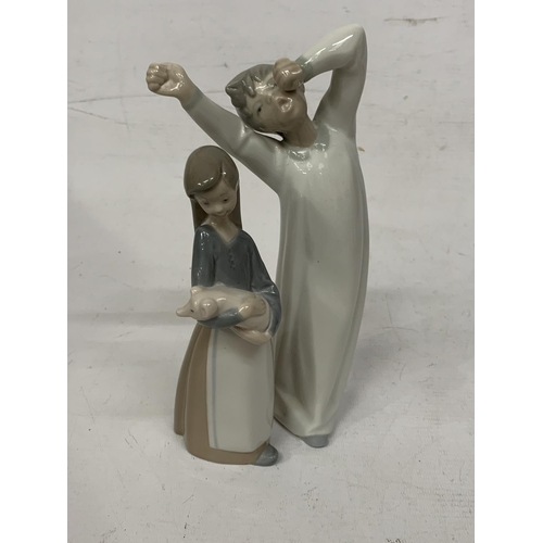 727 - TWO LLADRO FIGURES - BOY YAWNING IN A NIGHTGOWN AND A GIRL HOLDING A PIG