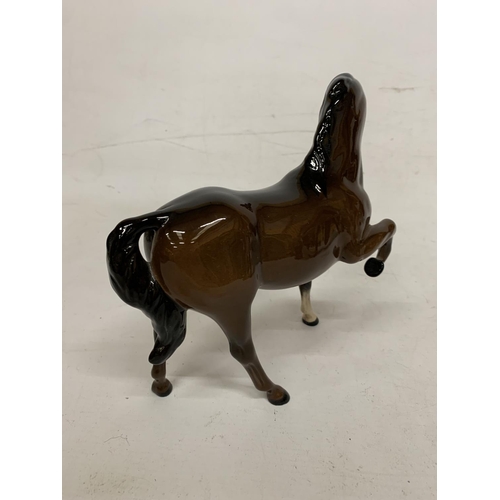 729 - A BOXED ROYAL DOULTON FIGURE OF A PRANCING STALLION