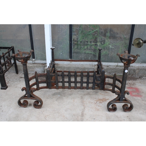 1503 - A VINTAGE CAST IRON FIRE GRATE WITH LARGE ATTATCHED FIRE DOGS