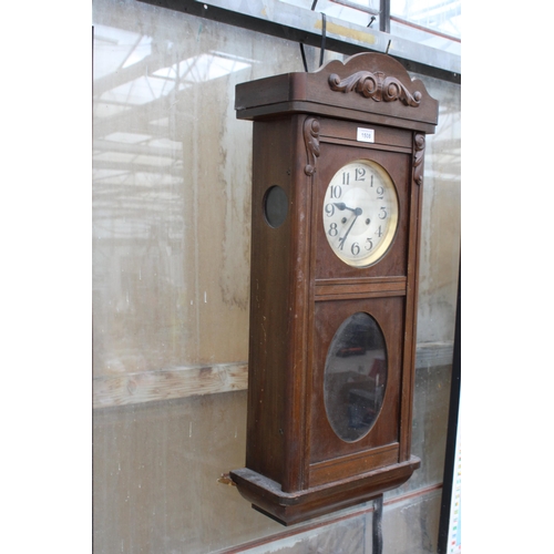 1508 - AN OAK CHIMING WALL CLOCK