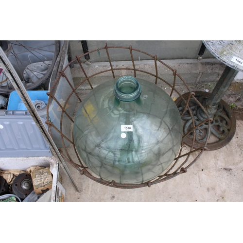 1510 - A LARGE VINTAGE GLASS CARBOY WITH WIRE CRATE