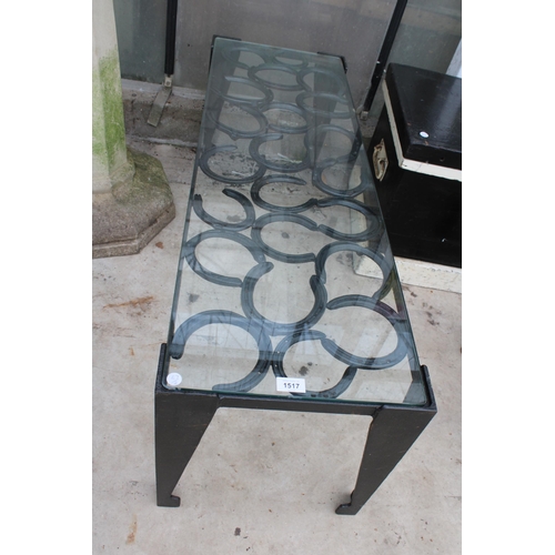 1517 - A VINTAGE STYLE METAL COFFEE TABLE WITH GLASS TOP AND FORMED FROM HORSE SHOES